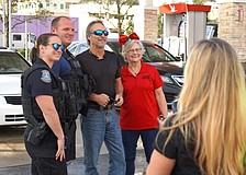 Sarasota Police Department on Dec. 2 gave away $2,000 in gasoline at three city stores, first offering to take photos with unsuspecting patrons.