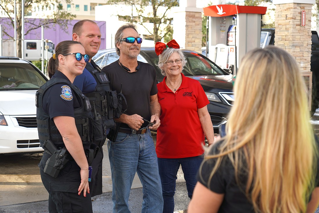 Sarasota Police Department on Dec. 2 gave away $2,000 in gasoline at three city stores, first offering to take photos with unsuspecting patrons.