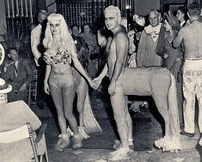 A costumed couple turns heads at one of Art Center Sarasota's legendary Beaux Arts Ball, a dazzling tradition set to return in March as part of the organization's yearlong centennial season celebration.