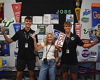 Seniors Gavin Moore, Abigail Frint and Ryan Johnson were among 12 students at Lakewood Ranch High School to set up and spread the word about the opportunities available at the new College and Career Center.