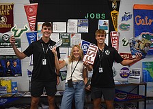 Seniors Gavin Moore, Abigail Frint and Ryan Johnson were among 12 students at Lakewood Ranch High School to set up and spread the word about the opportunities available at the new College and Career Center.