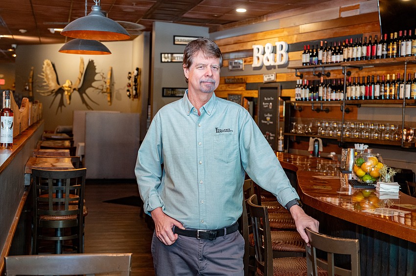 Co-owner Steve Bishop inside B&B's Barrel Room, a cozy space that pairs fine dining with a relaxed, speakeasy vibe.