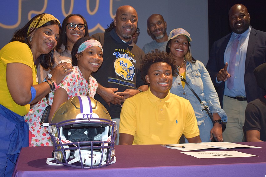 Dylan Wester smiles for a photo after signing with Pittsburgh. The three-star signee is tied for first among Booker pass-catchers with 12 touchdowns and second with 775 yards.