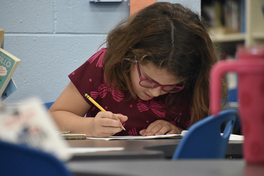 Second grader Abigail Vargas works on an assignment.