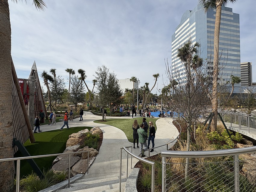Riverfront Plaza park features green space, paths and play areas.