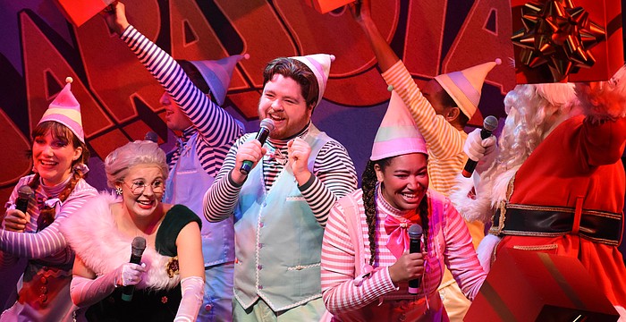 Jolly (Flynn Nolen, center) is surrounded by the other characters including Candy (Christiana Allison), Mrs. Claus (Jillian Hurley), Jangle (Ray Barber), Tinsel (Vanessa Smith), Jingle (Mareece Love) and Santa Claus (Dellan Short).