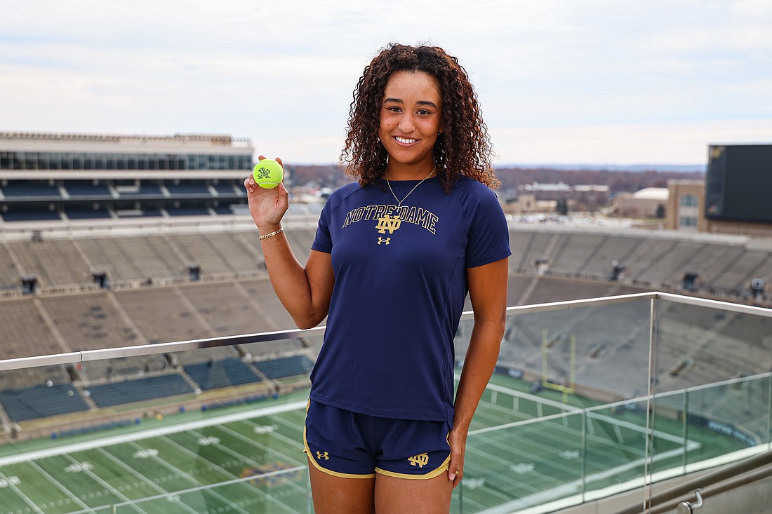 Gabriella Rawles holds a Fighting Irish tennis ball and poses for a photo at Notre Dame Stadium. The senior at ICL Academy online is headed to South Bend, Indiana, in January as an early enrollee.