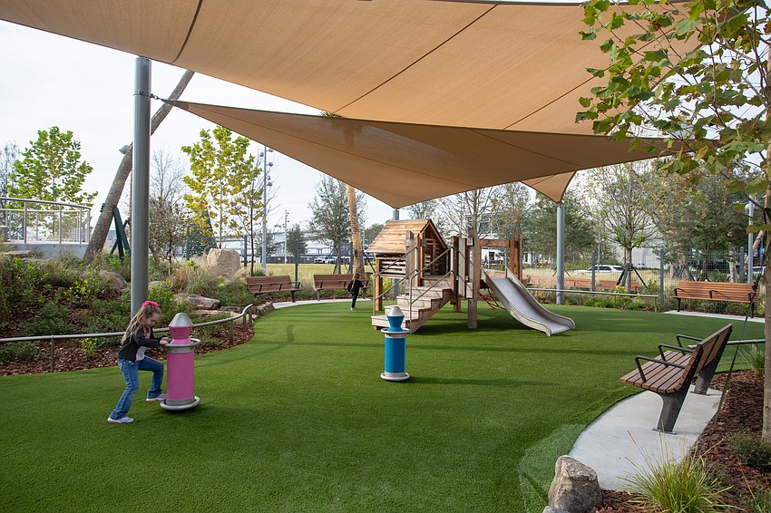 Riverfront Plaza park features multiple play areas for children.