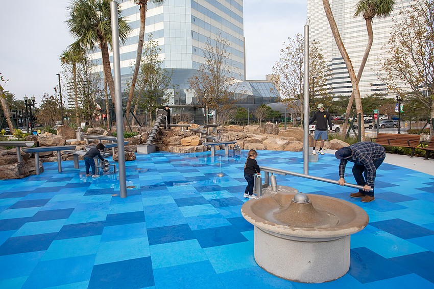 Riverfront Plaza park features multiple play areas for children.