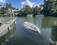 Sarasota Police on Monday recovered a sunken, capsized boat from Hudson Bayou that had been swamped for more than three years.
