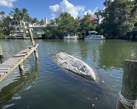 Sarasota Police on Monday recovered a sunken, capsized boat from Hudson Bayou that had been swamped for more than three years.