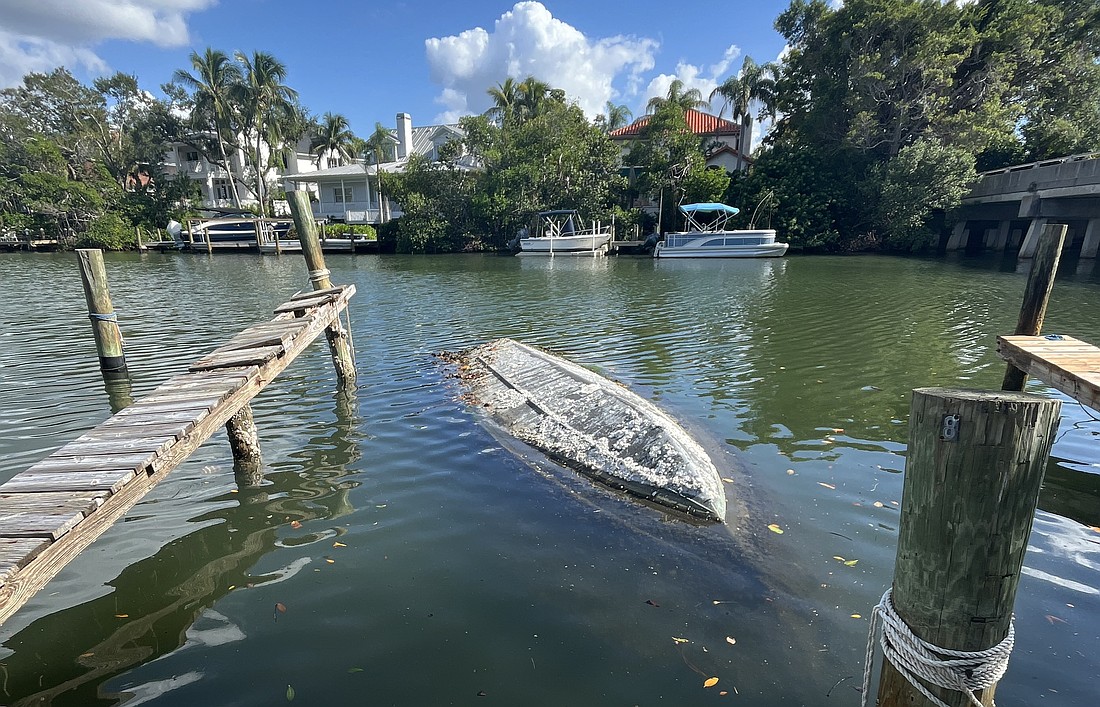 Sarasota Police on Monday recovered a sunken, capsized boat from Hudson Bayou that had been swamped for more than three years.