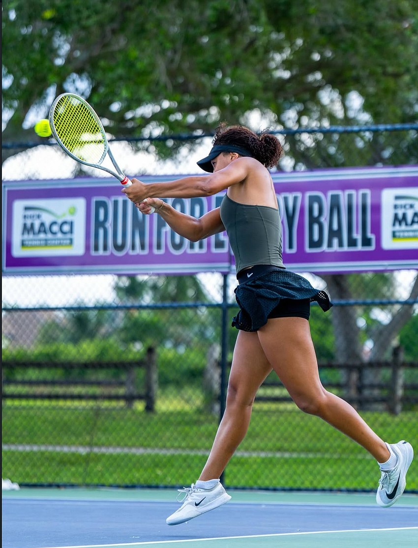 Gabriella Rawles reaches up for a backhand return during a match. The senior at ICL Academy reached the women's semifinals of the PTT Boca Raton on Oct. 18, her most recent UTR result.
