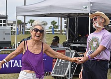 St. Petersburg's Ella Brown and Sarasota's Mike Chambers take full advantage of the live music to show off their best dance moves at the Lakewood Ranch Blues Festival on Dec. 6.