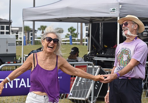 St. Petersburg's Ella Brown and Sarasota's Mike Chambers take full advantage of the live music to show off their best dance moves at the Lakewood Ranch Blues Festival on Dec. 6.