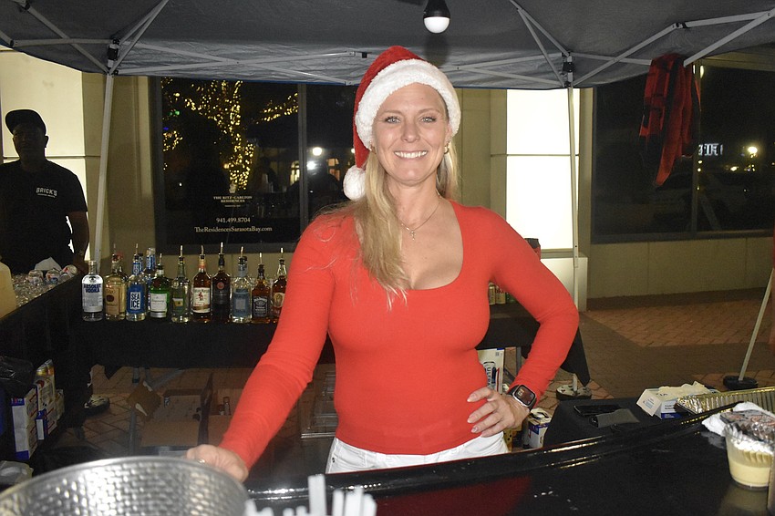 Nicole Stuzman of Brick's Smoked Meats brought the festive spirit.