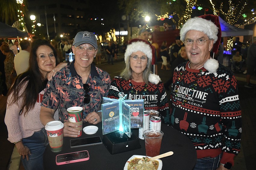 Rick and Tina Walters, and Tom and Cindy Bourdon share a table.