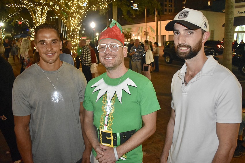 Nick Perrine, Michael Sobotka and Austin Oakes await the tree lighting.