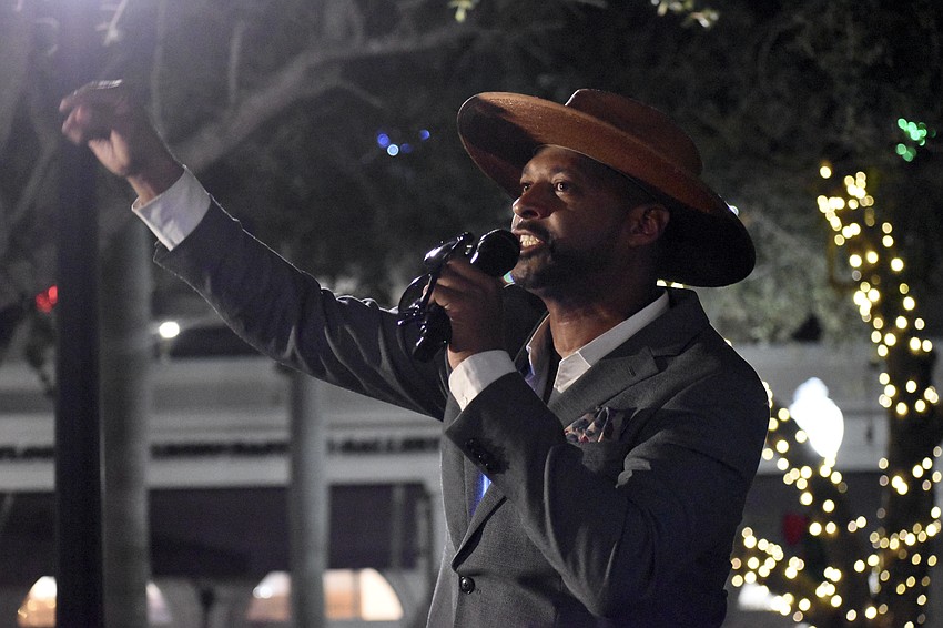 Commissioner Kyle Battie speaks before the lighting of the tree.