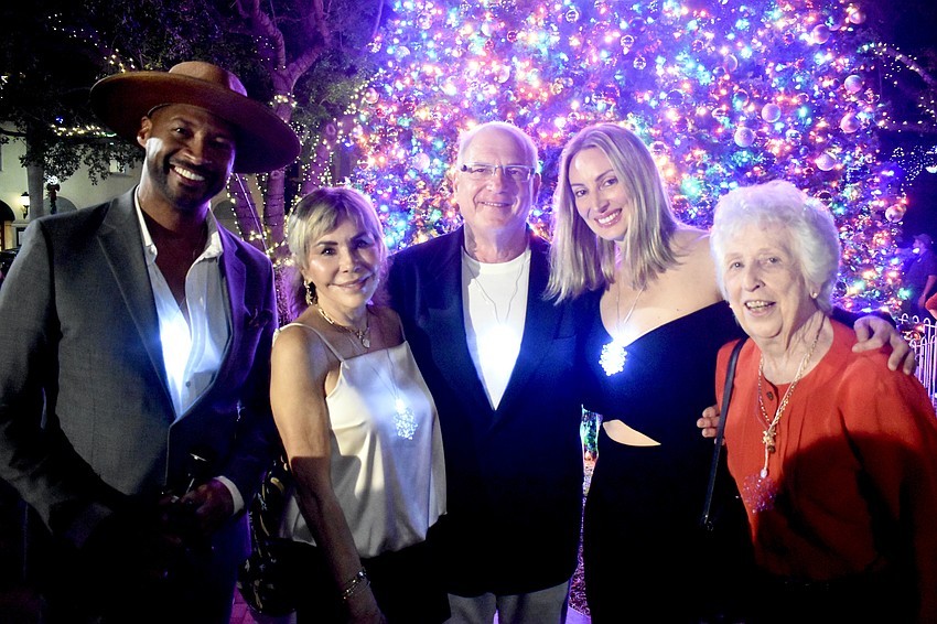 Taking to the stage for the lighting were Commissioner Kyle Battie and members of the Downtown Improvement District board including Chris Voelker, Vice Chair Wayne Ruben, Harmoni Krusing and Eileen Hampshire.