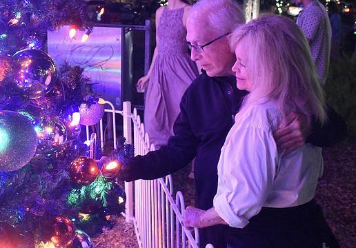 Debi and Mike O'Leary take a look at the tree.