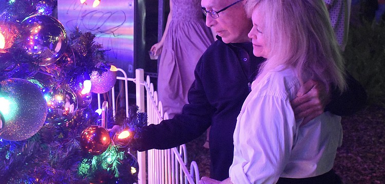 Debi and Mike O'Leary take a look at the tree.