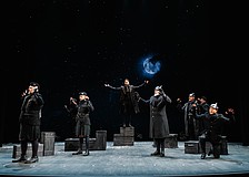 The moon rises as German and English troops gather together in "No Man's Land" to celebrate the birth of Christ in Asolo Rep's "All Is Calm: The Christmas Truce of 1914."