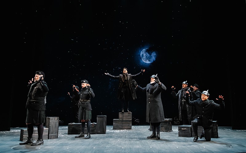 The moon rises as German and English troops gather together in "No Man's Land" to celebrate the birth of Christ in Asolo Rep's "All Is Calm: The Christmas Truce of 1914."