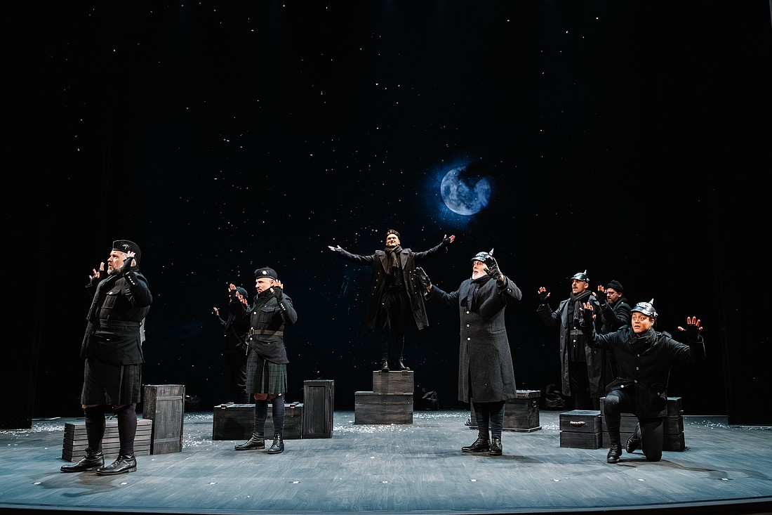 The moon rises as German and English troops gather together in "No Man's Land" to celebrate the birth of Christ in Asolo Rep's "All Is Calm: The Christmas Truce of 1914."
