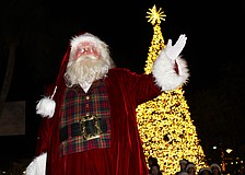 With a sparkle in his eye and a wave of the hand, jolly old St. Nick illuminated the lights on St. Armands Circle's 60-foot Christmas tree at a lighting festival on Dec. 5.