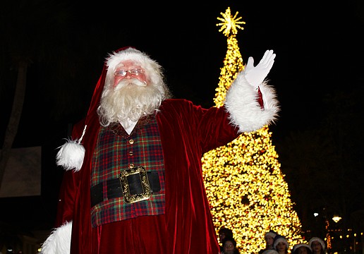 With a sparkle in his eye and a wave of the hand, jolly old St. Nick illuminated the lights on St. Armands Circle's 60-foot Christmas tree at a lighting festival on Dec. 5.