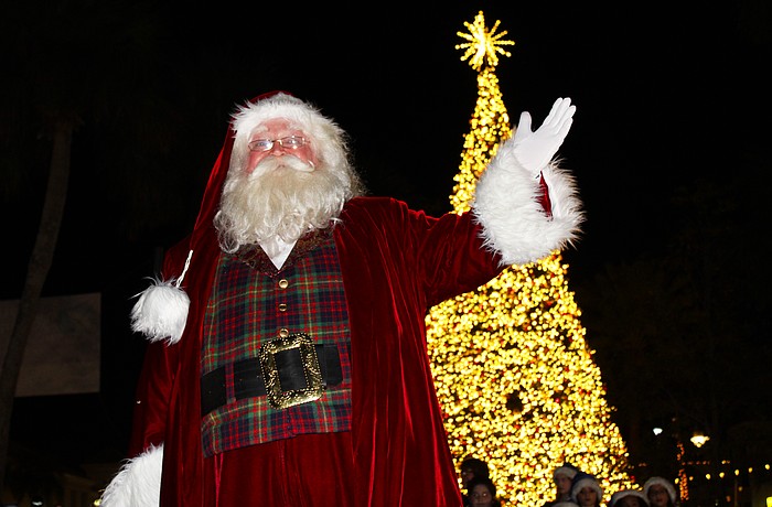 With a sparkle in his eye and a wave of the hand, jolly old St. Nick illuminated the lights on St. Armands Circle's 60-foot Christmas tree at a lighting festival on Dec. 5.