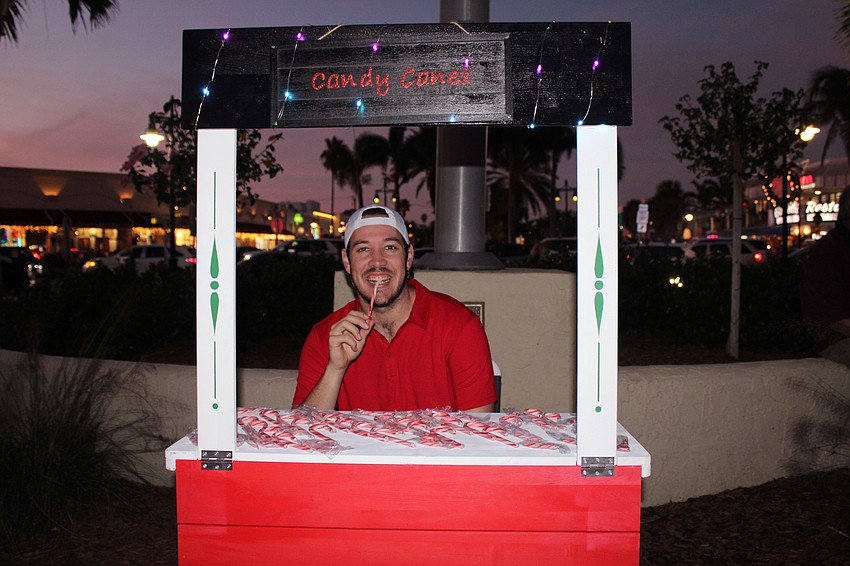 Connor Floyd was all smiles while handing out free candy canes at Holiday Night on the Circle, courtesy of the St. Armands Circle Association.
