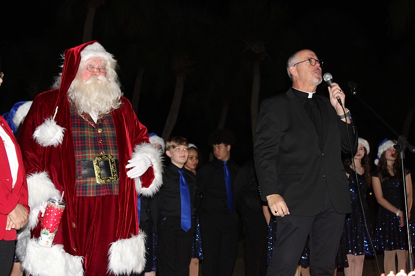 Rev. Kenneth Blyth of St. Armands Key Lutheran Church offers a prayer before the Christmas tree lighting.