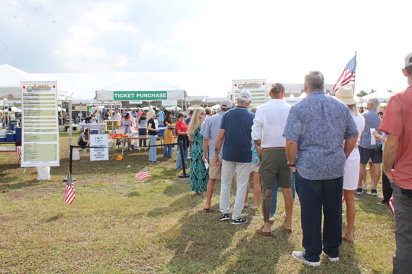 Despite early rain predictions and overcast skies early on, the Kiwanis Club of Longboat Key's Lawn Party celebration avoided the rain this year.