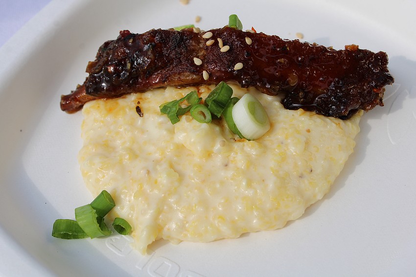 Sticky Asian-style glazed ribs top smoked Gouda polenta with toasted sesame seeds and green onion at the Lazy Lobster booth.