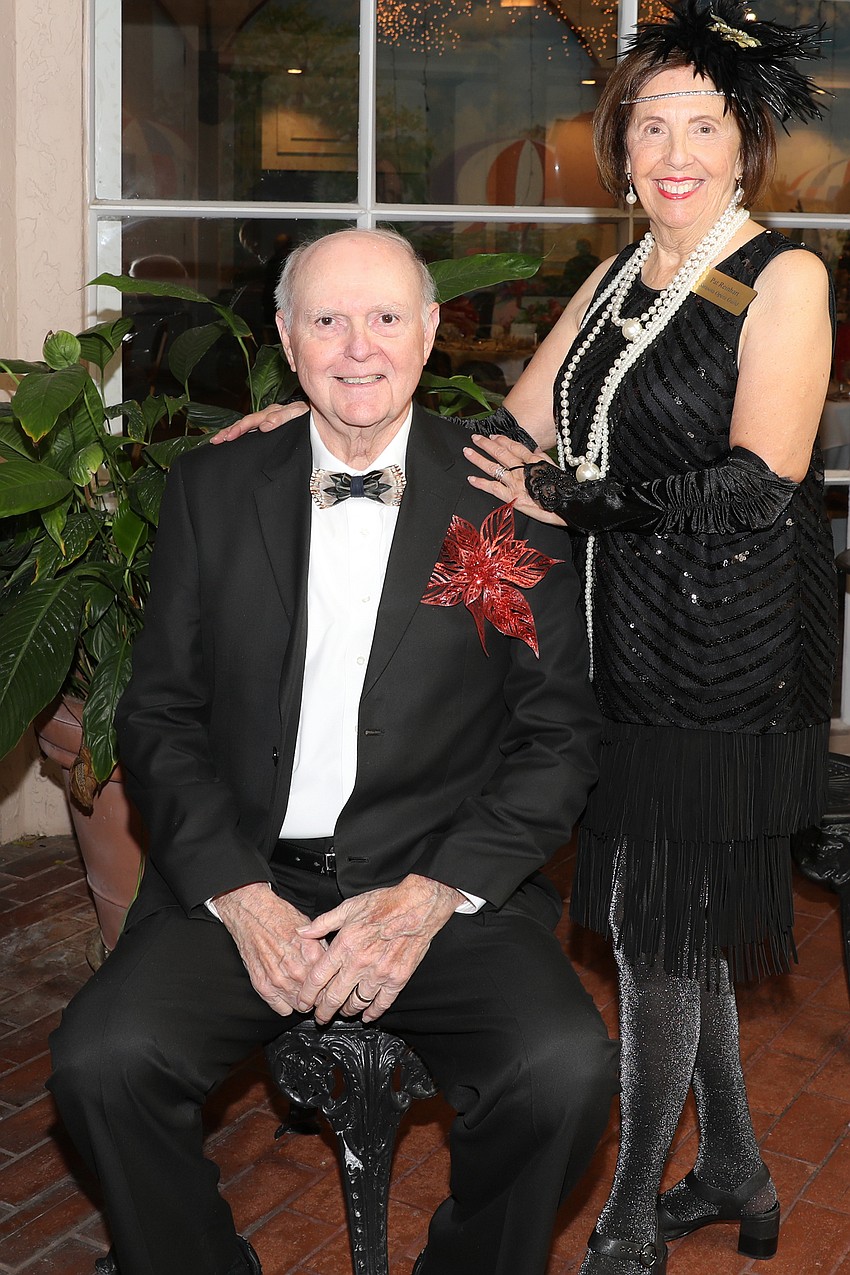 Greg Rinehart gives his wife, Pat, full credit for making sure he looks good for a Gatsby-themed luncheon.