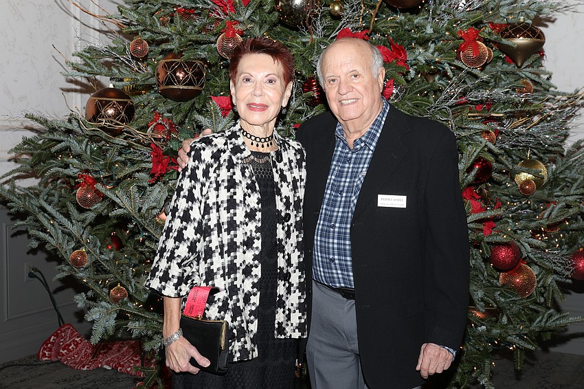 Elana Carnes and Tyler Cassell with the Michael's On East Christmas Tree.