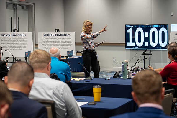 Director of Government Relations Stephanie Garrison leads the work session Dec. 3.