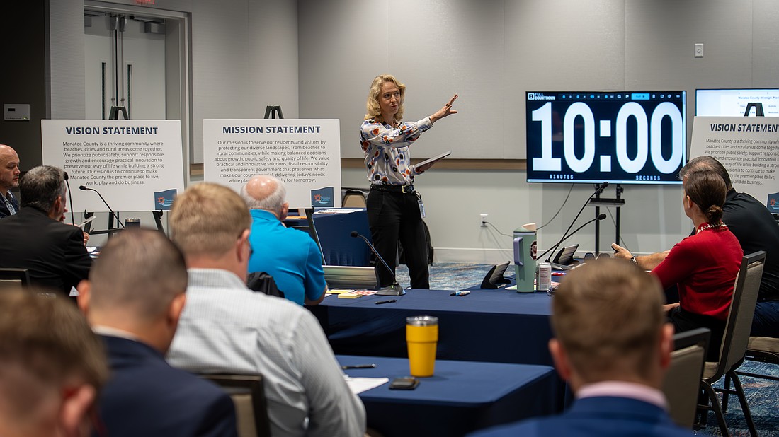 Director of Government Relations Stephanie Garrison leads the work session Dec. 3.