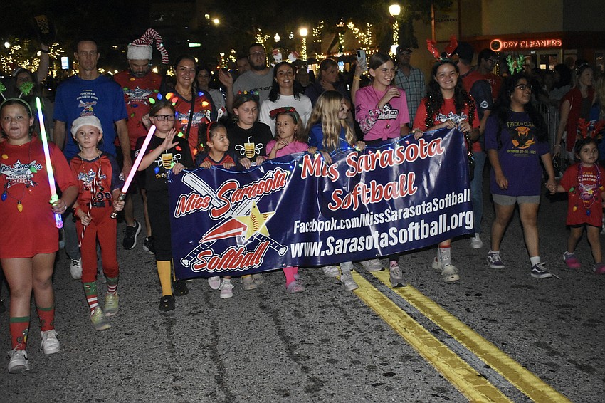 Miss Sarasota Softball heads down Main Street.
