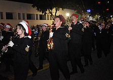 Students from Sarasota High School's marching band walk in the parade.