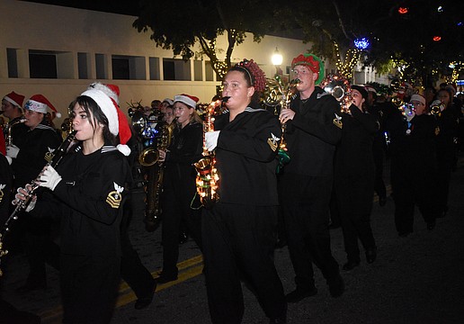 Students from Sarasota High School's marching band walk in the parade.