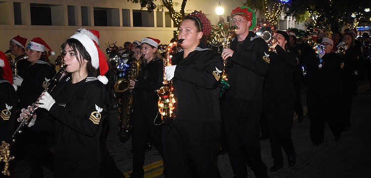 Students from Sarasota High School's marching band walk in the parade.