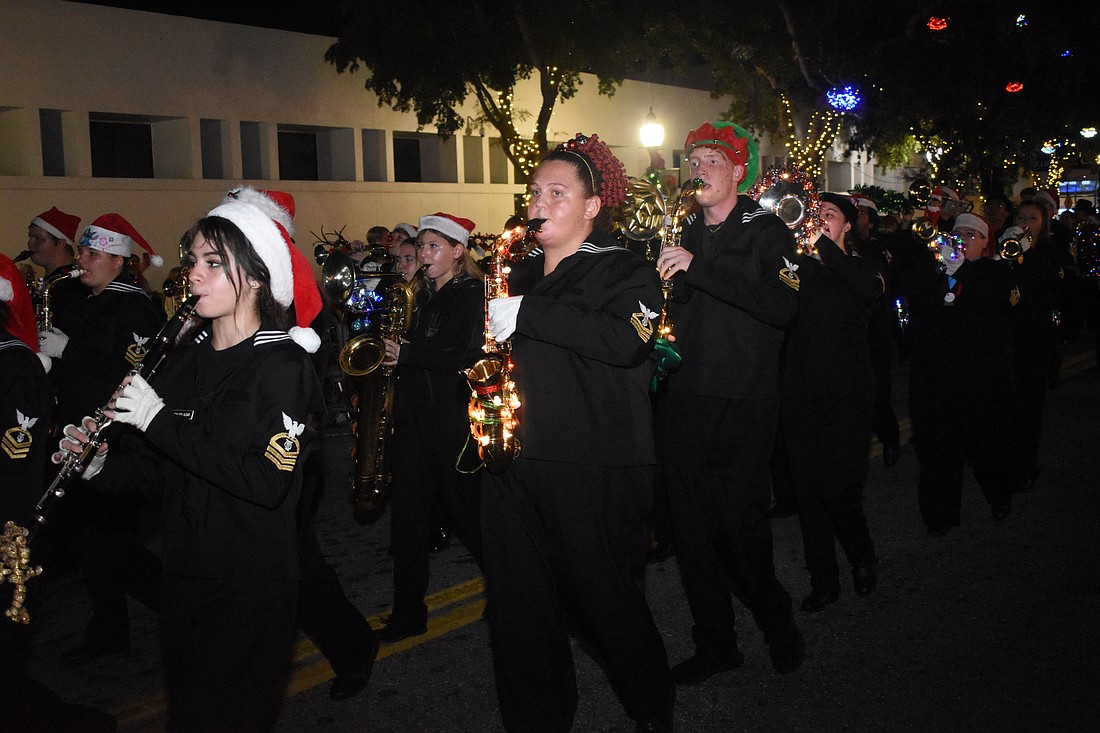 Students from Sarasota High School's marching band walk in the parade.