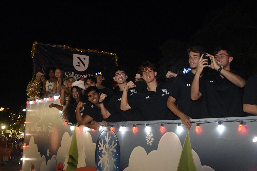Students at New College of Florida travel down Main Street.