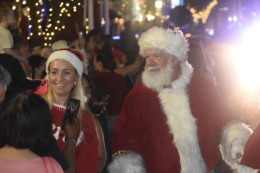 Rachele Casasola takes a selfie with Santa Claus.
