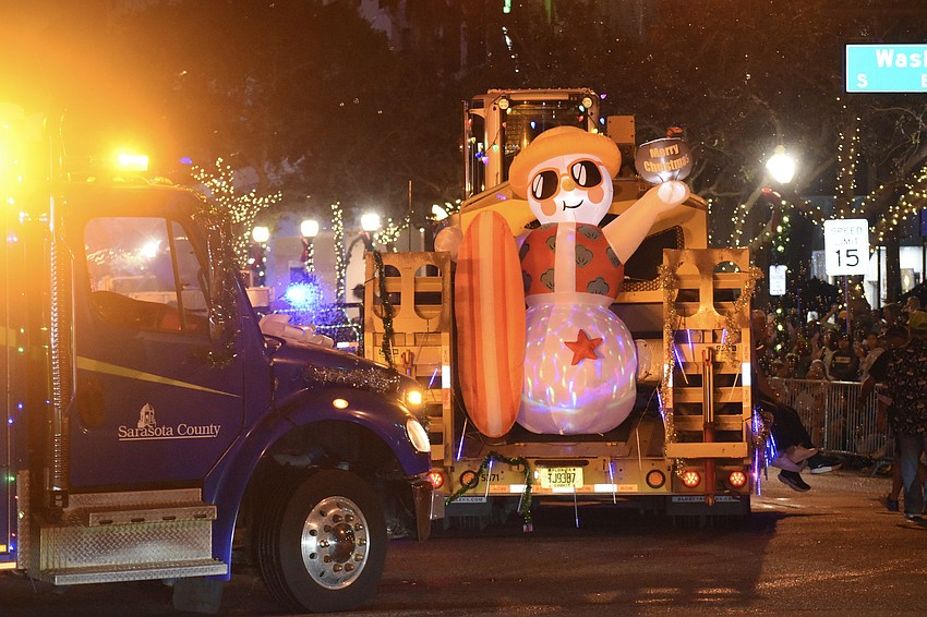 Vehicles from Sarasota County including Sarasota County Stormwater, make their way across the parade route.
