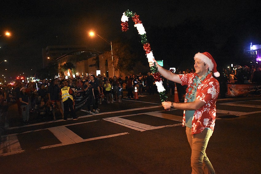 Dan Sidler of the Greater Sarasota Chamber of Commerce walks in the parade.