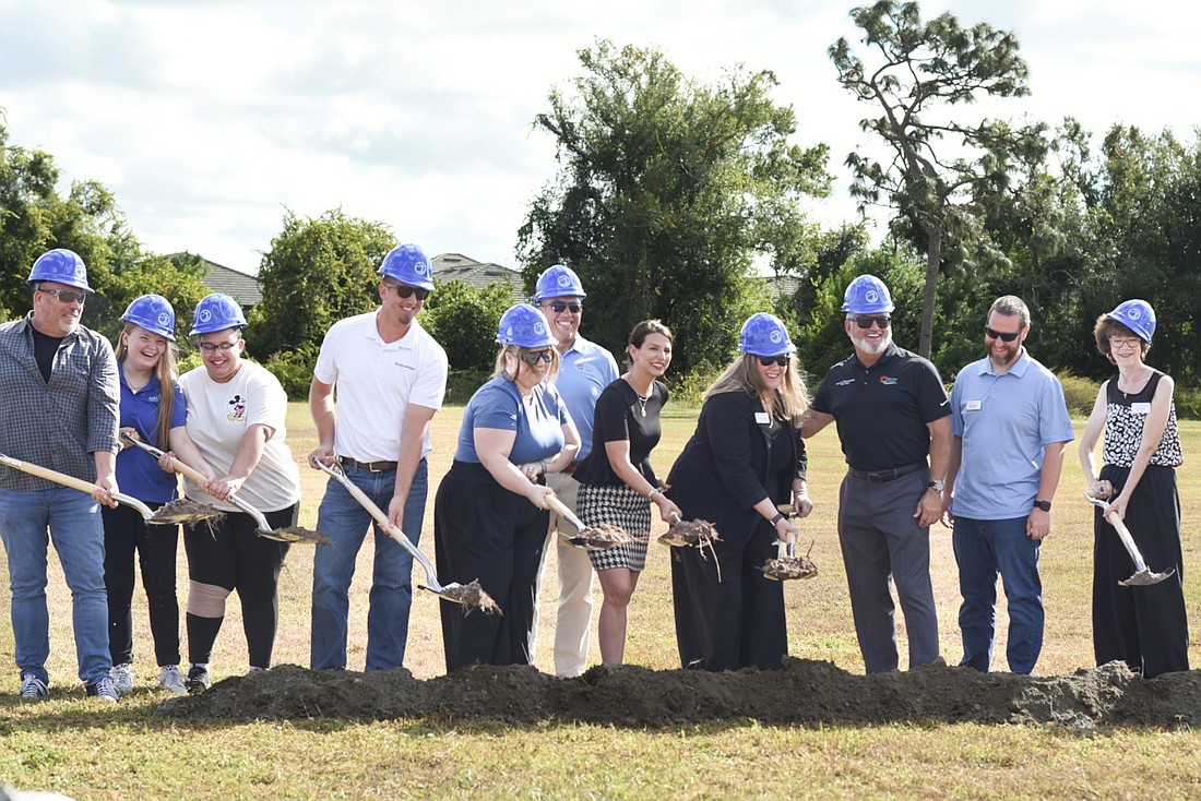 Harbor58 volunteers and Manatee County commissioners put the first shovels in the ground Nov. 17.